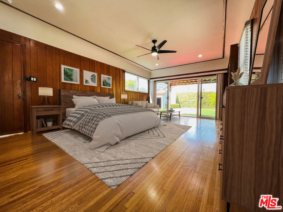 6187 Barrows Drive Los Angeles, CA 90048 - Photo 29 of 35 a spacious bedroom with a large bed and a chandelier