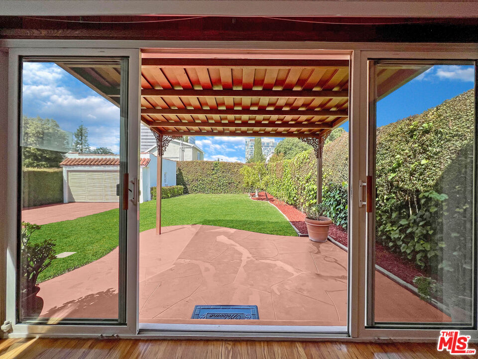 6187 Barrows Drive Los Angeles, CA 90048 - Photo 31 of 35 a view of a porch with a yard