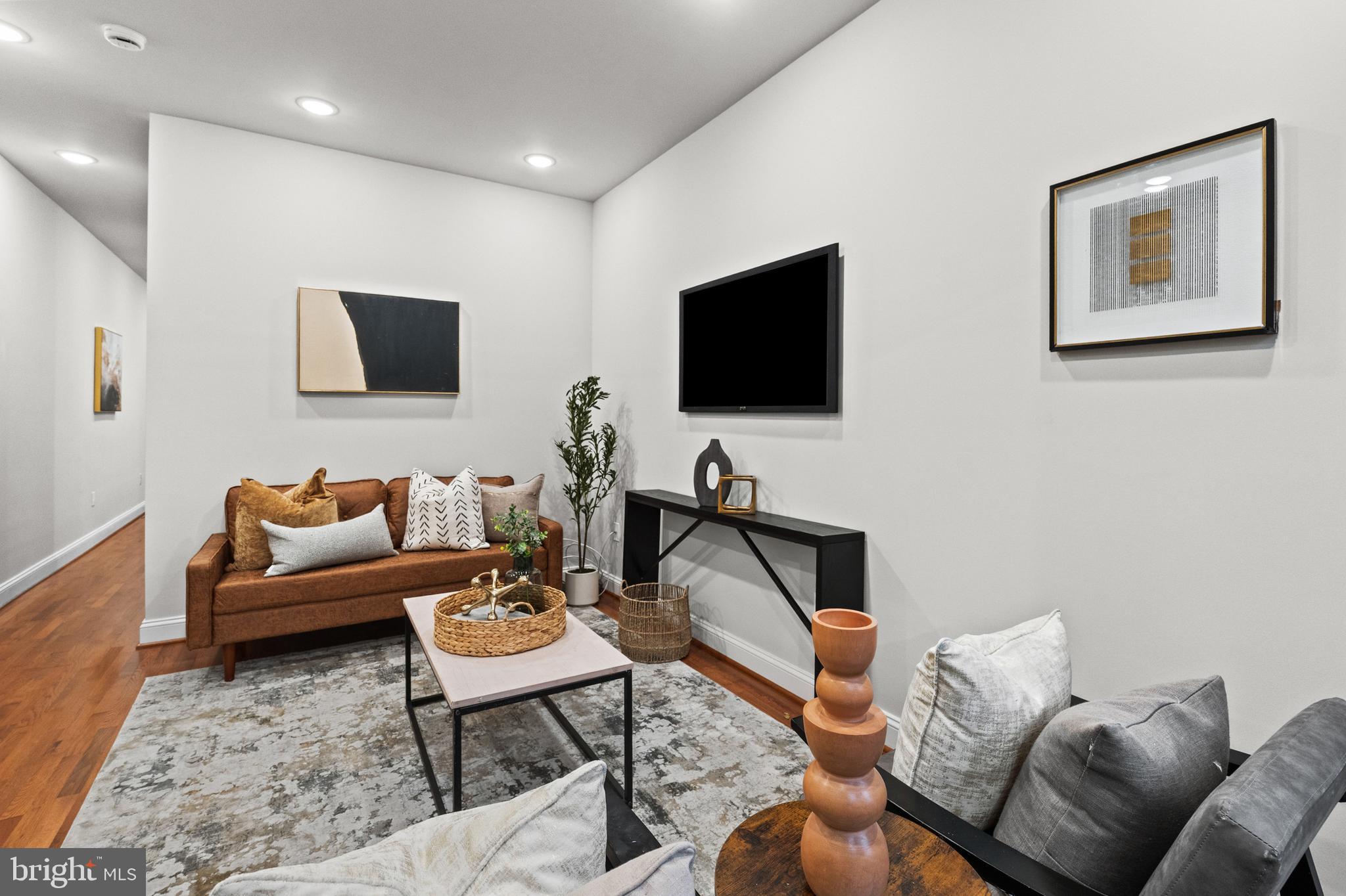 2103 McCulloh Street Baltimore, MD 21217 - Photo 11 of 56 a living room with furniture and a flat screen tv