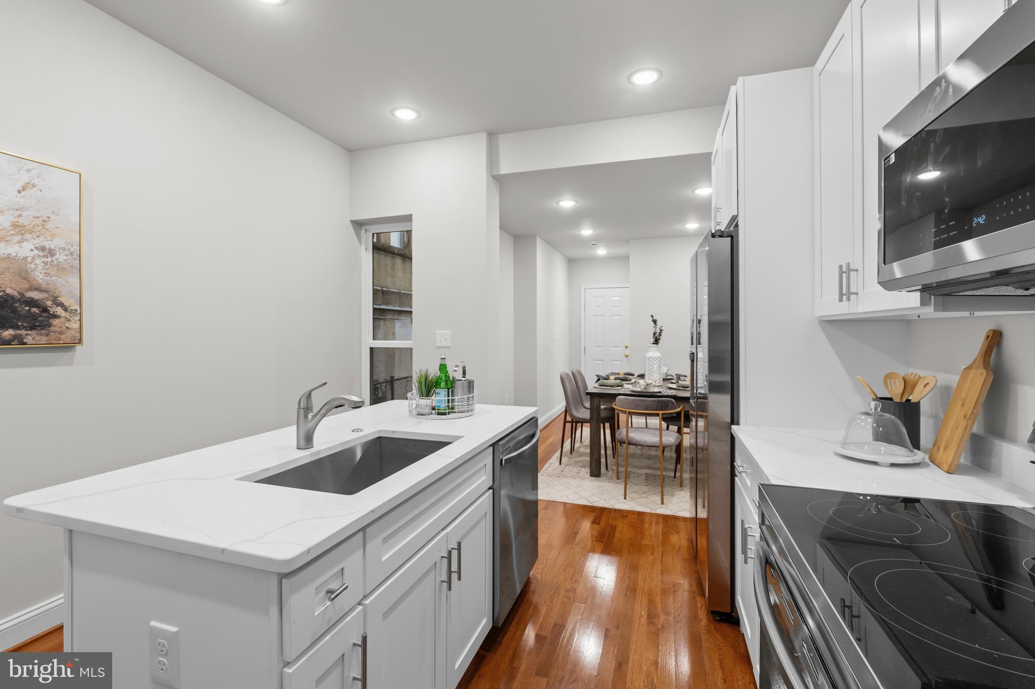 2103 McCulloh Street Baltimore, MD 21217 - Photo 17 of 56 a kitchen with sink refrigerator and stove