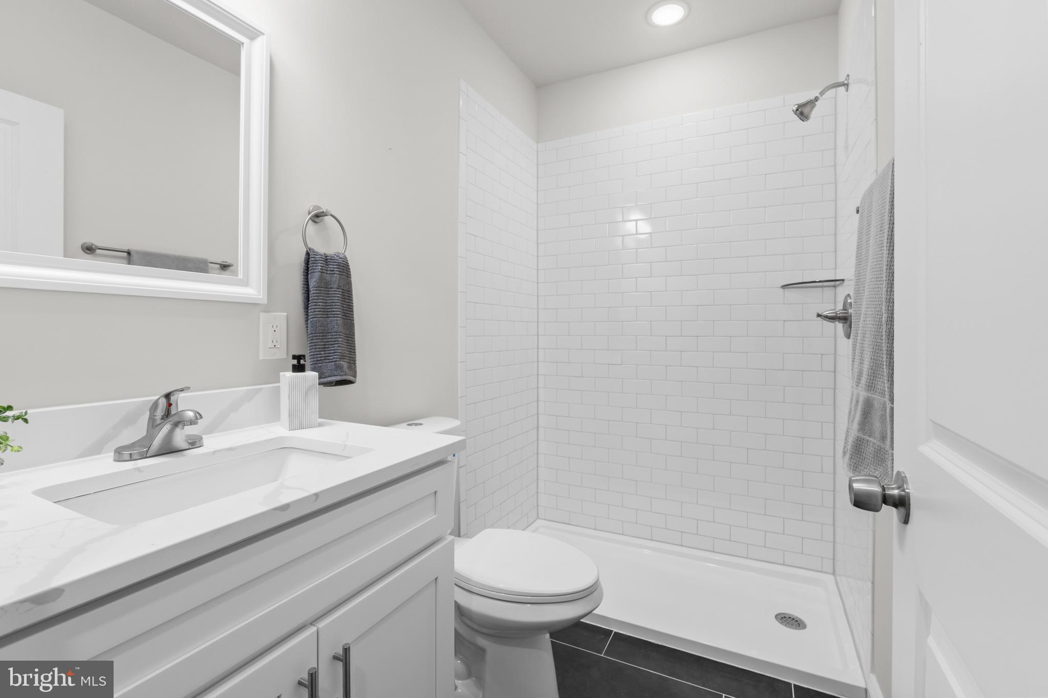 2103 McCulloh Street Baltimore, MD 21217 - Photo 18 of 56 a bathroom with a sink toilet and shower