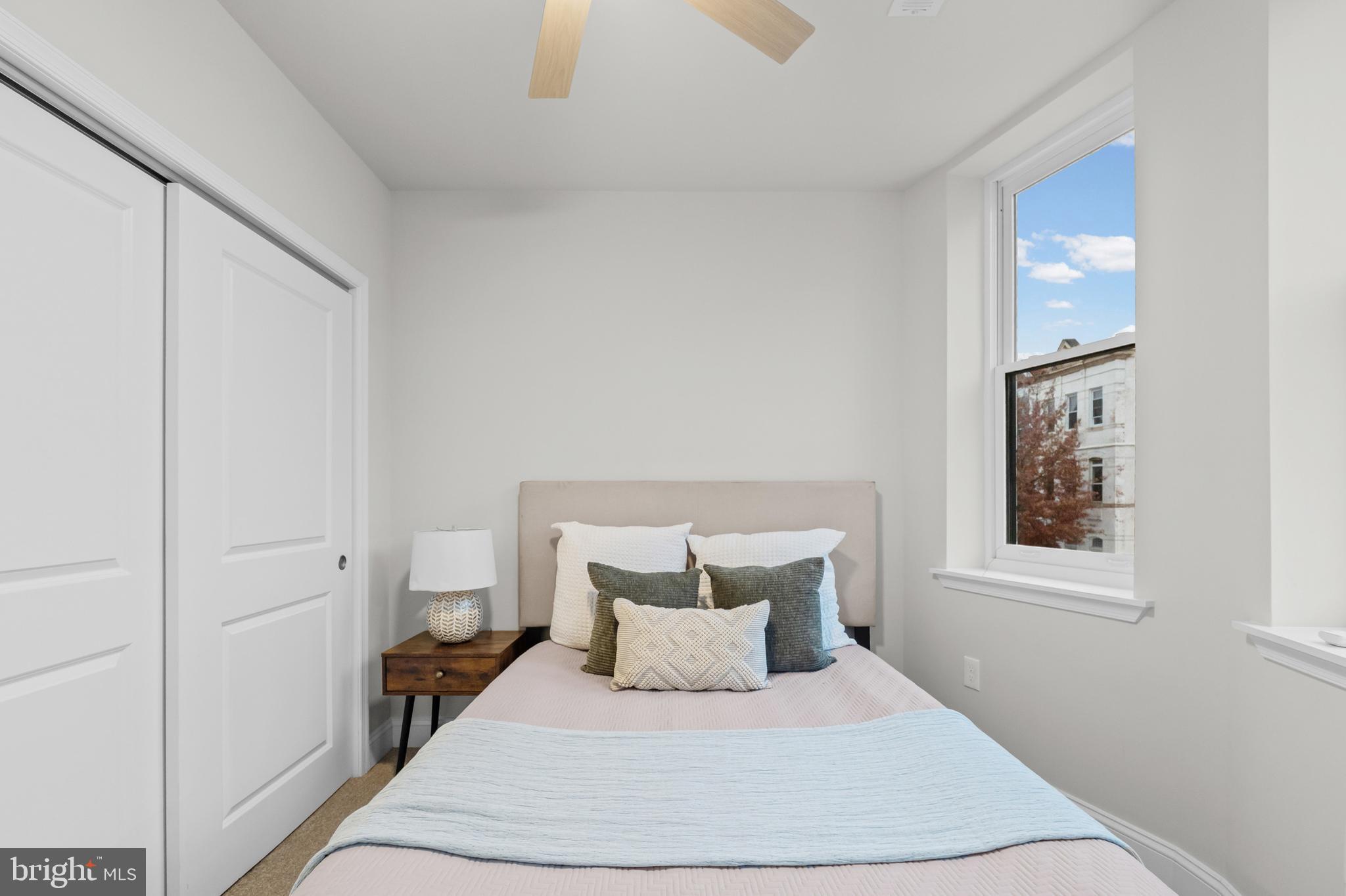 2103 McCulloh Street Baltimore, MD 21217 - Photo 20 of 56 a bedroom with a bed and a window