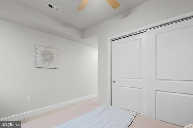 a bedroom with bed and a window