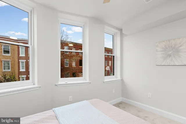 an empty room with a empty space and a window