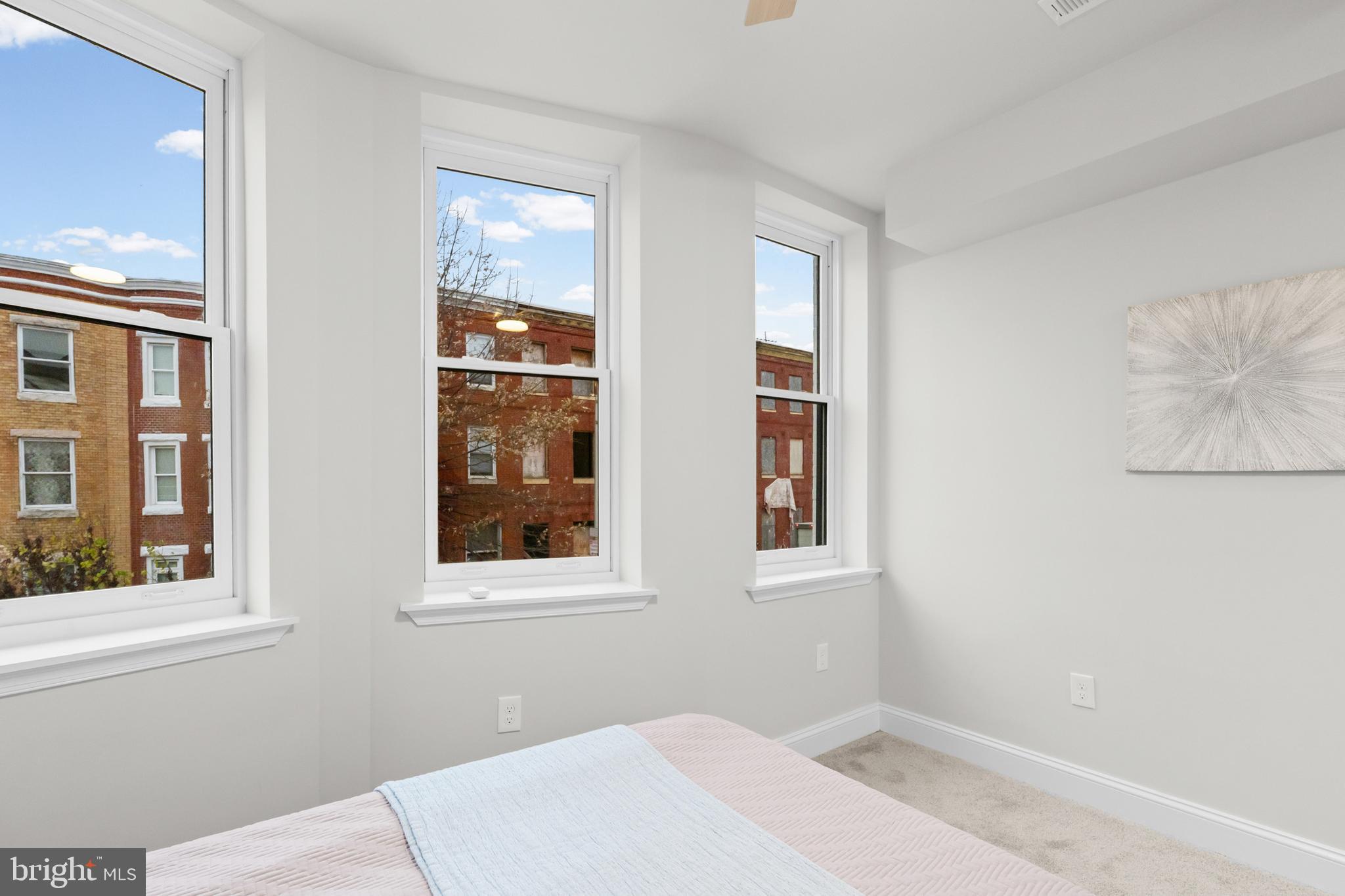 2103 McCulloh Street Baltimore, MD 21217 - Photo 22 of 56 a bedroom with bed and a window