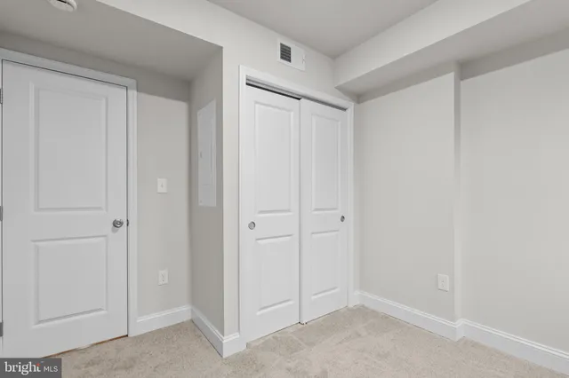 a bathroom with a sink toilet and a mirror