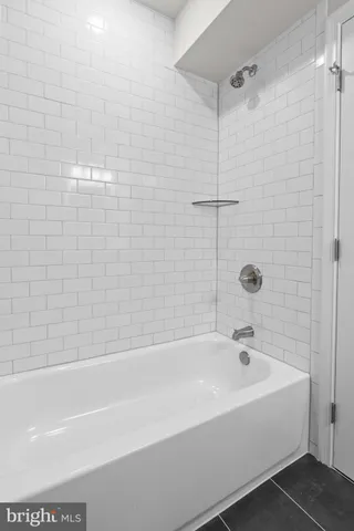 a bathroom with a sink and shower