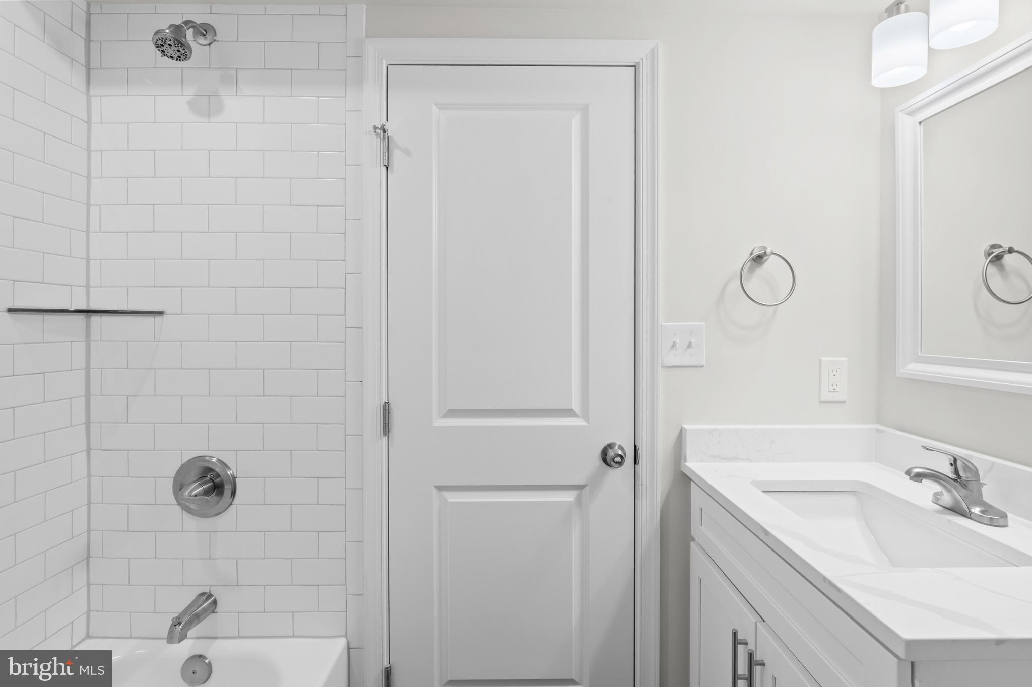 2103 McCulloh Street Baltimore, MD 21217 - Photo 30 of 56 a bathroom with a sink and shower