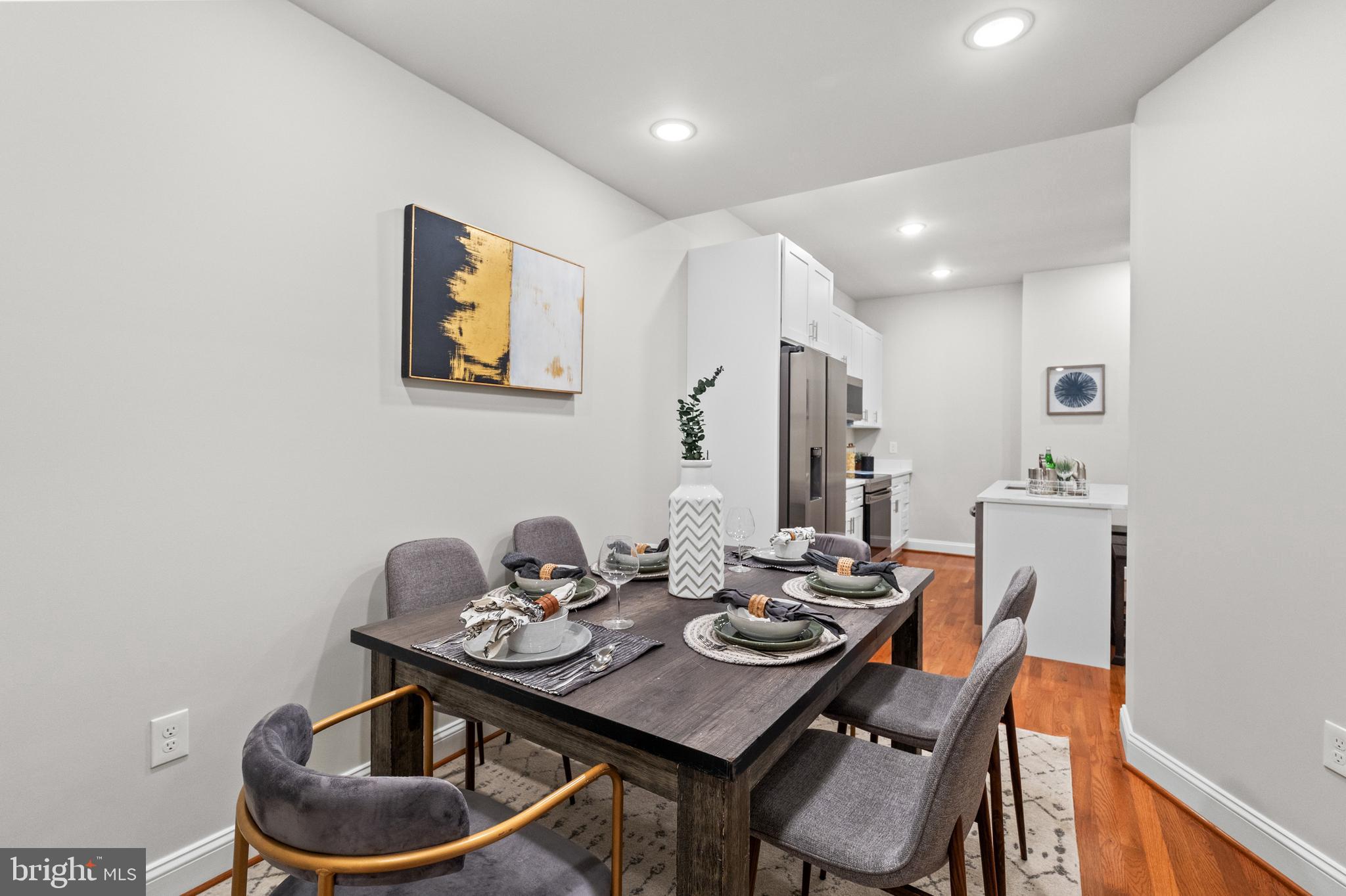 2103 McCulloh Street Baltimore, MD 21217 - Photo 3 of 56 a view of a dining room with furniture and wooden floor