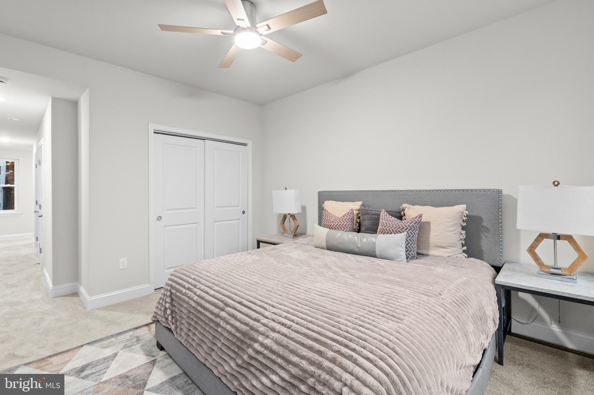 2103 McCulloh Street Baltimore, MD 21217 - Photo 38 of 56 a bedroom with a large bed and a chandelier