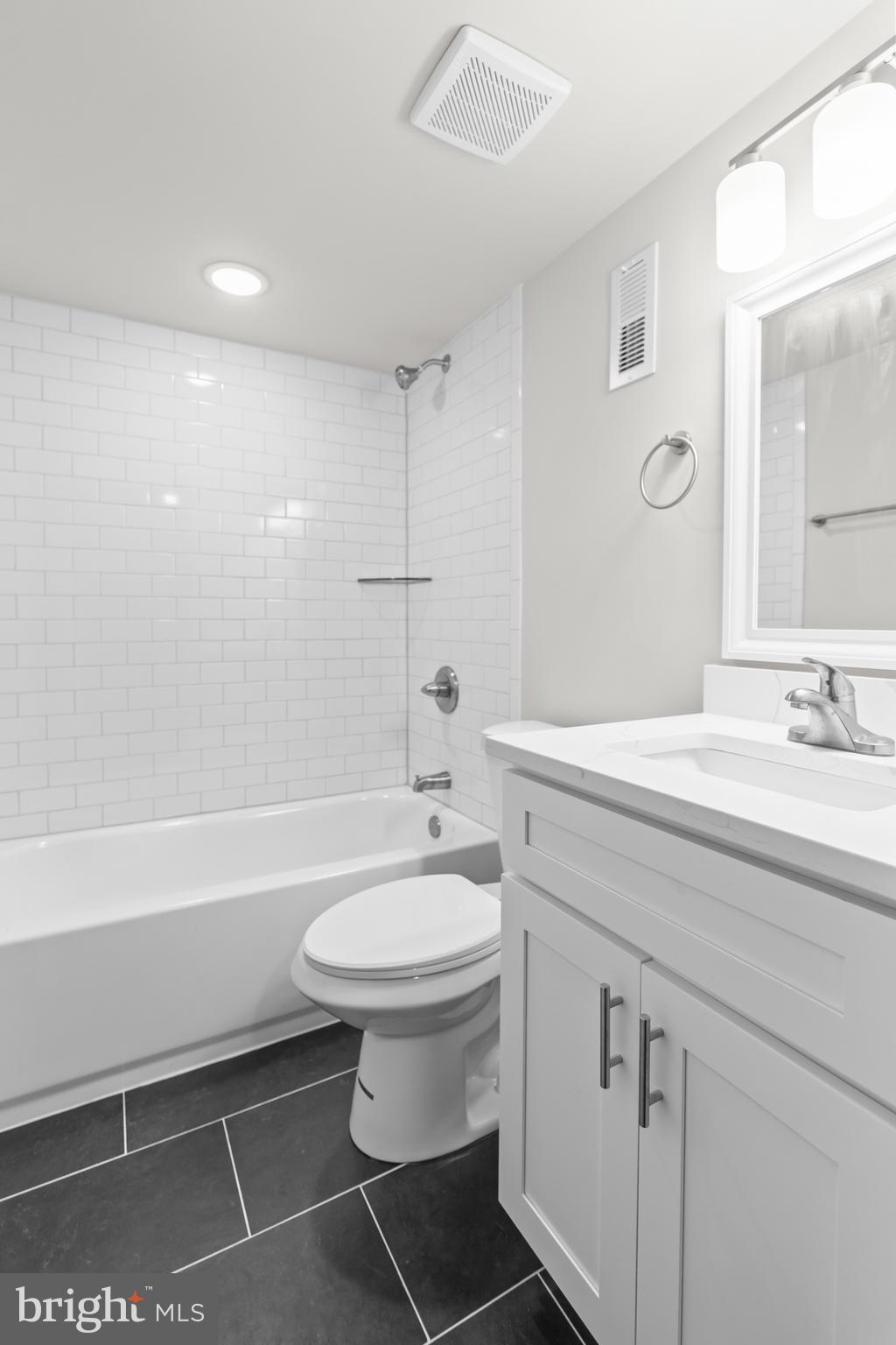 2103 McCulloh Street Baltimore, MD 21217 - Photo 42 of 56 a bathroom with a sink a toilet and shower