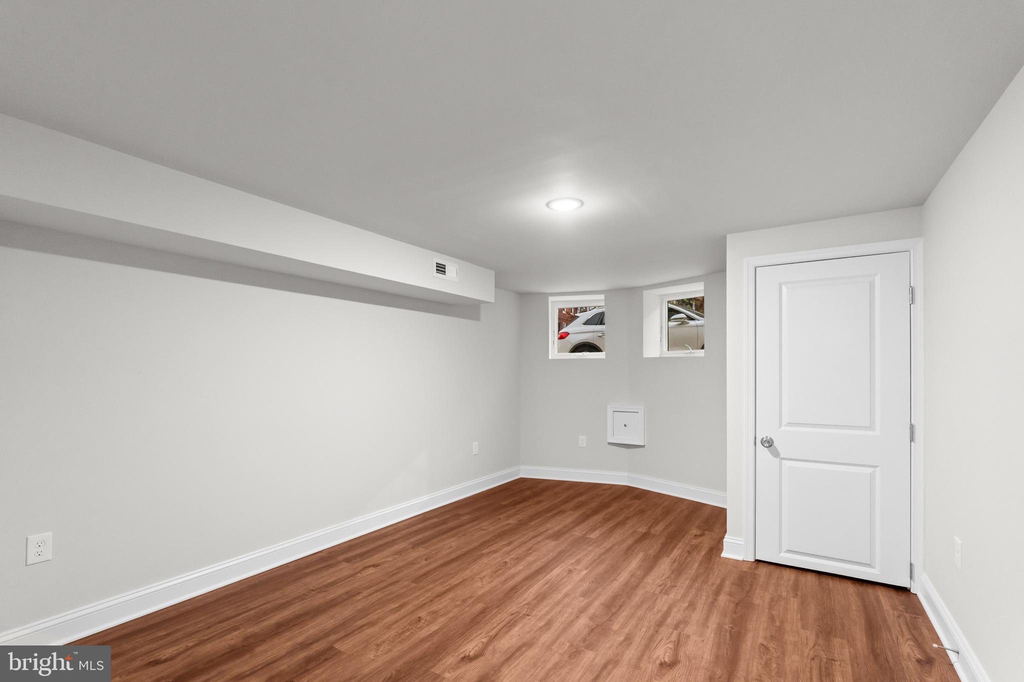 2103 McCulloh Street Baltimore, MD 21217 - Photo 43 of 56 a view of empty room with wooden floor