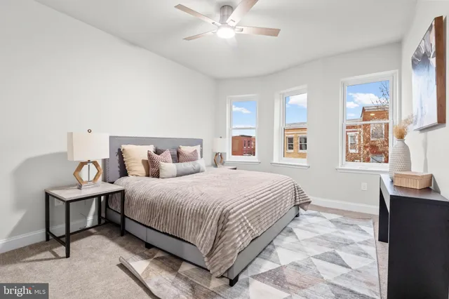 a bedroom with a bed and window