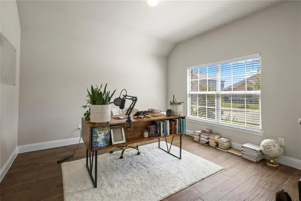 a workspace with furniture and a window