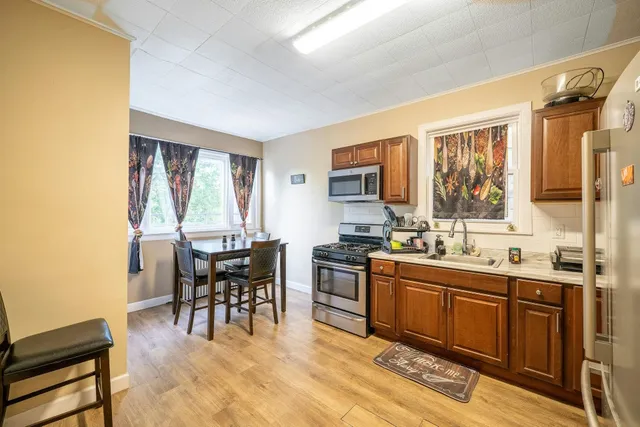 a view of a dining room with furniture and window
