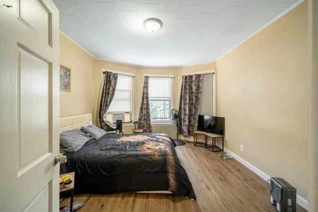 a bed room with a bed and a window