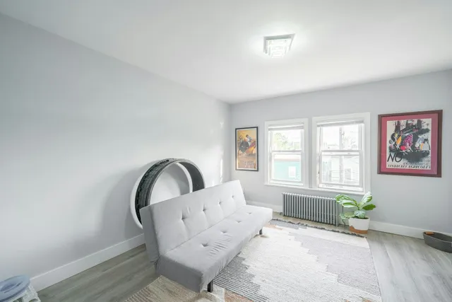 a living room with furniture and windows
