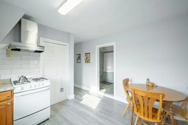 a view of a kitchen and dining room