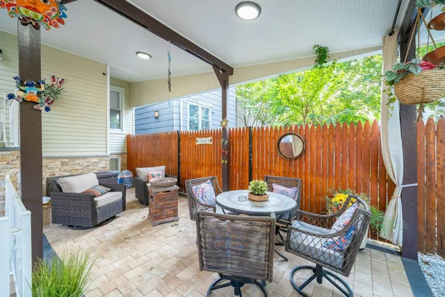 a view of a chairs and table in the patio