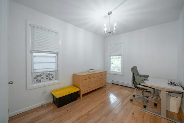 a workspace with furniture and window