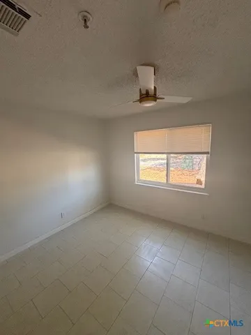 a view of a patio with a yard