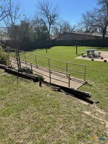 a view of a pool with a yard