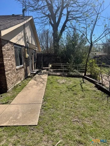 a view of a park with large trees