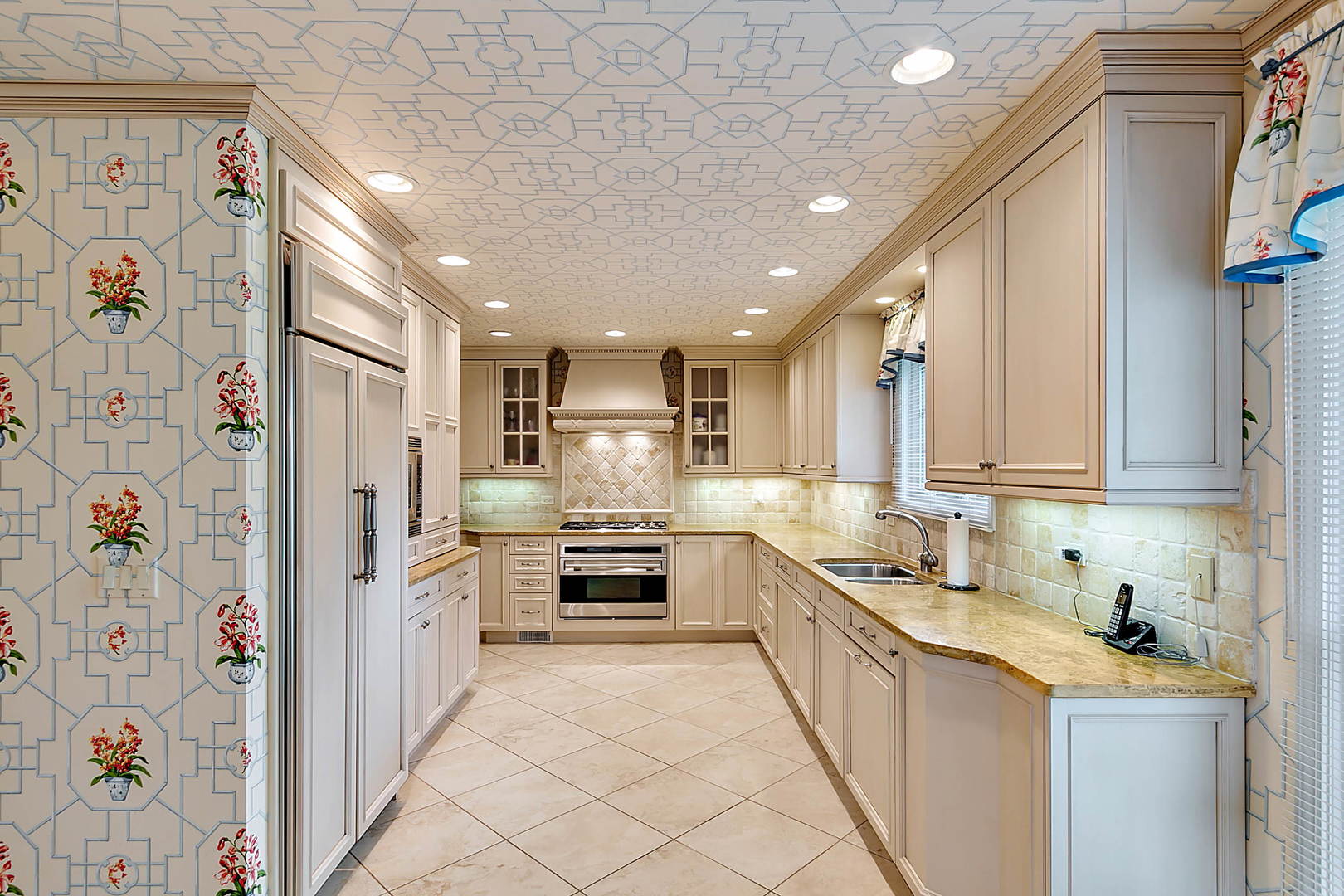 2552 Indian Ridge Court Glenview, IL 60026 - Photo 13 of 45 a kitchen with stainless steel appliances a refrigerator sink and cabinets
