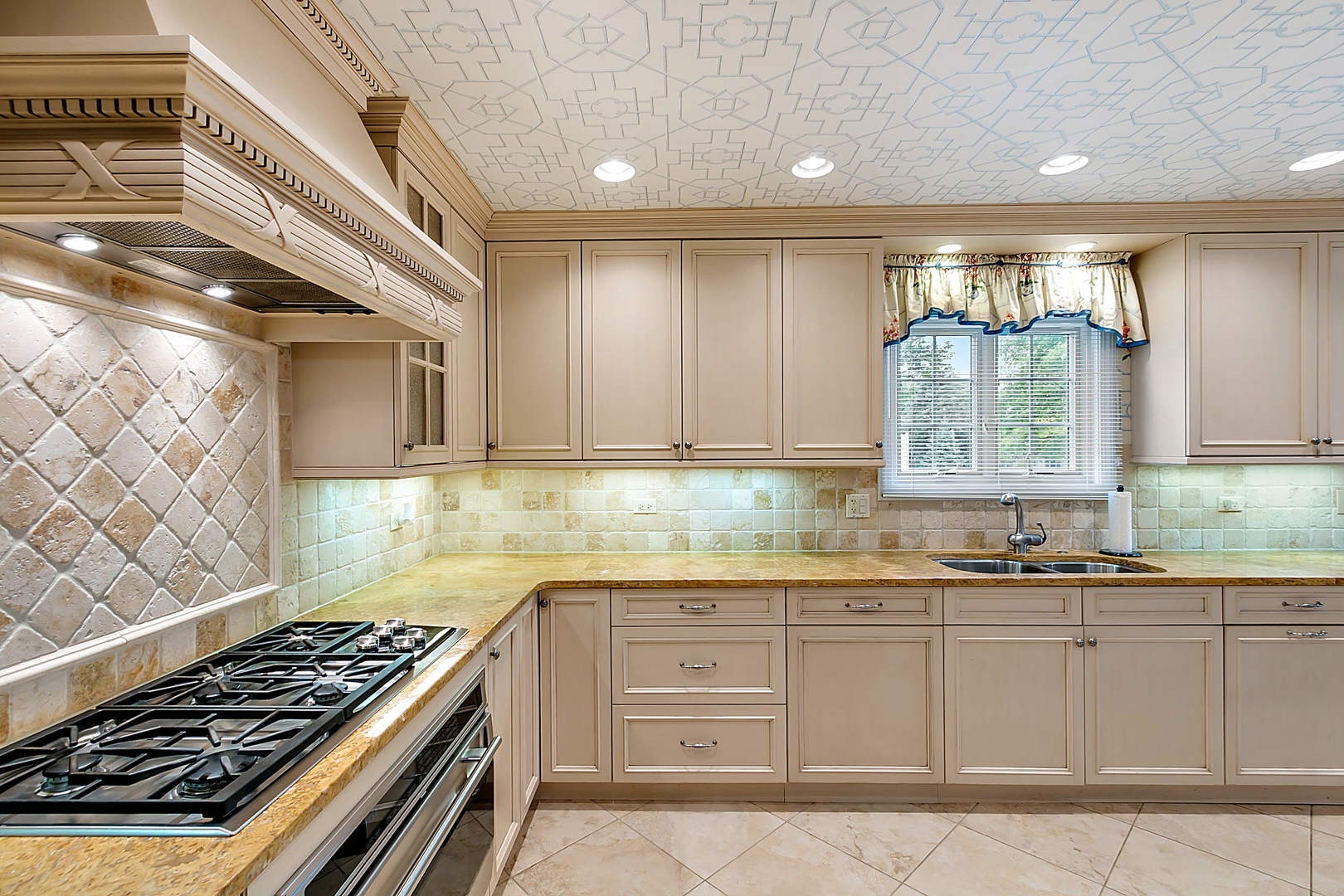 2552 Indian Ridge Court Glenview, IL 60026 - Photo 14 of 45 a kitchen with granite countertop a sink and a stove