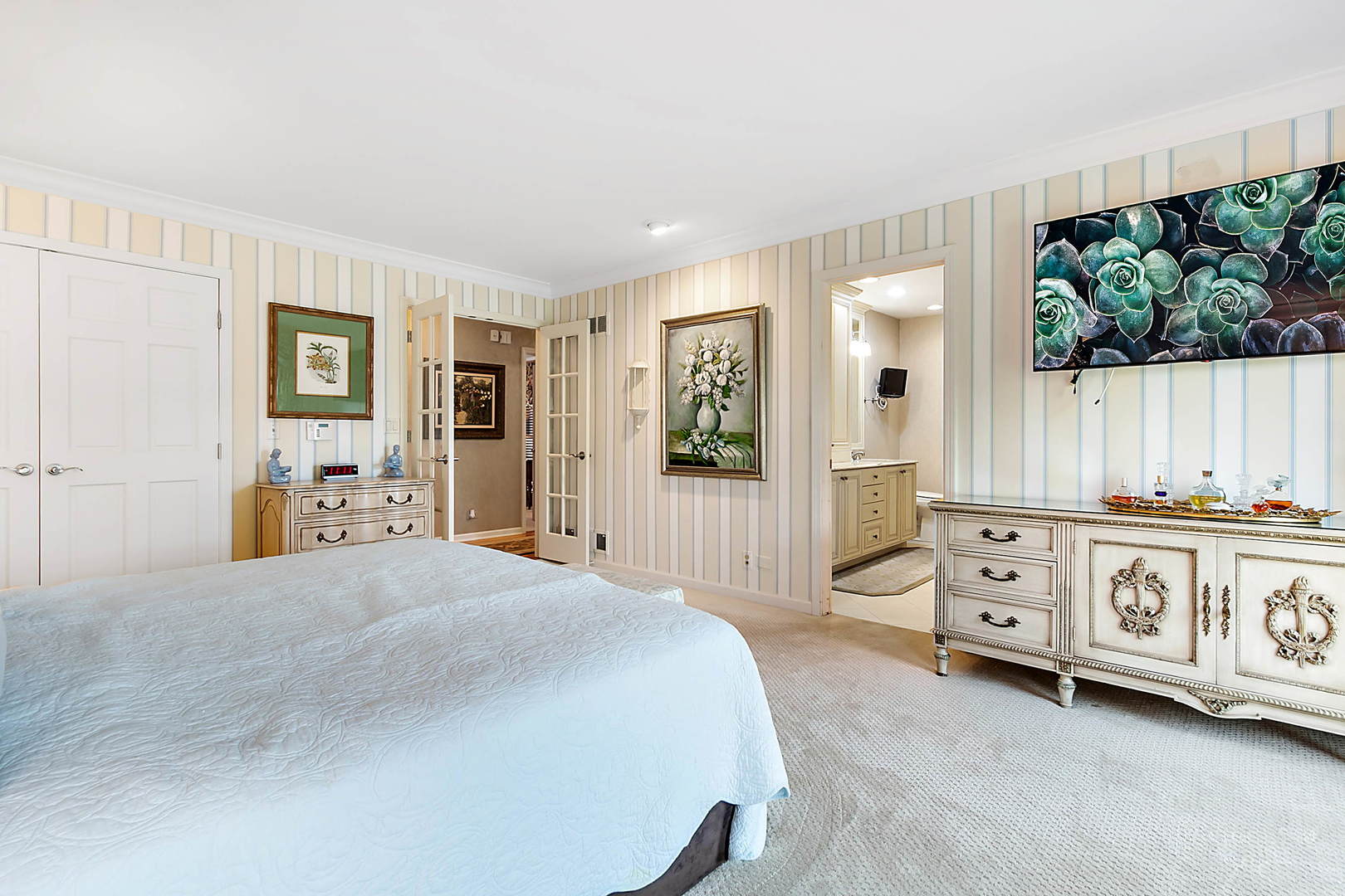 2552 Indian Ridge Court Glenview, IL 60026 - Photo 25 of 45 a spacious bedroom with a bed a window and dresser