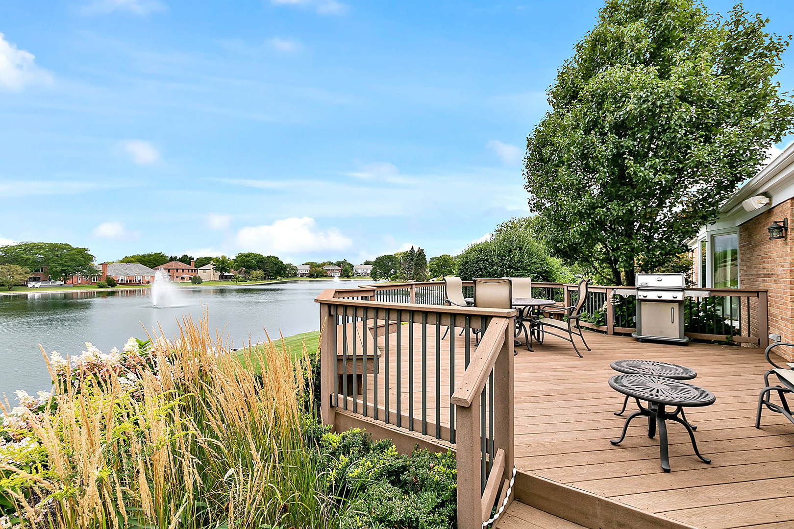 2552 Indian Ridge Court Glenview, IL 60026 - Photo 34 of 45 a balcony with wooden benches and lake view