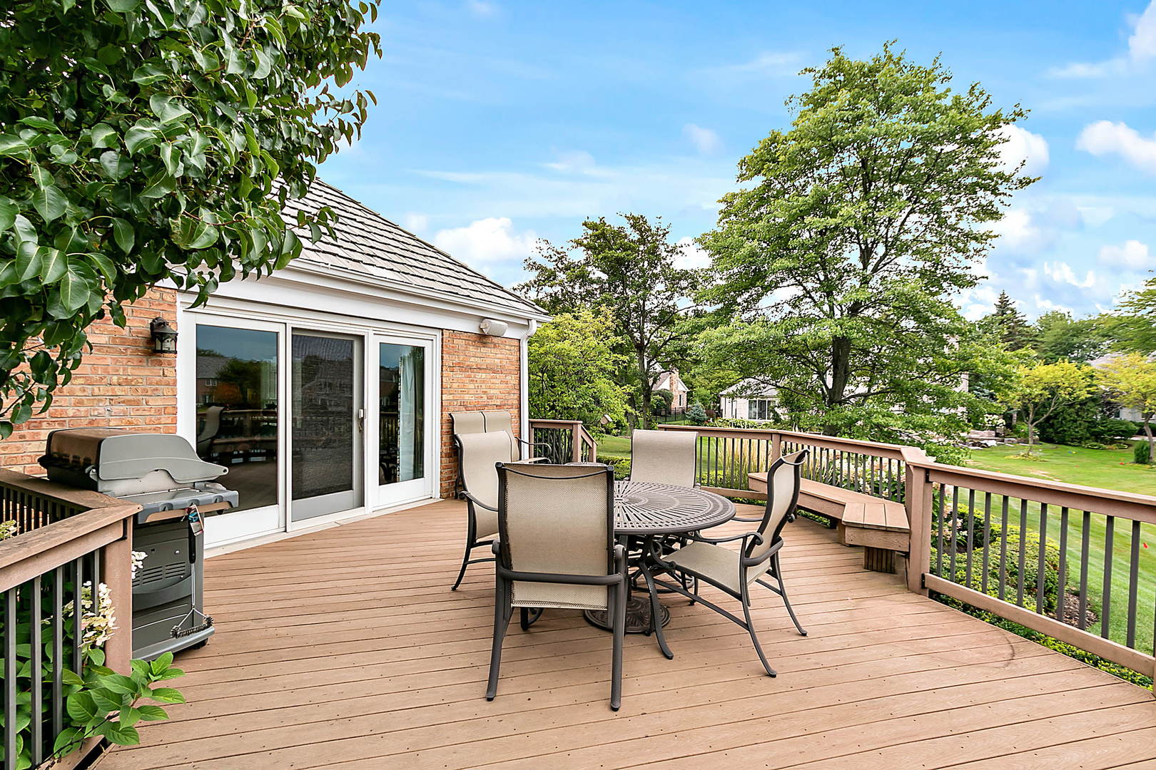 2552 Indian Ridge Court Glenview, IL 60026 - Photo 35 of 45 a view of a roof deck with table and chairs and wooden floor