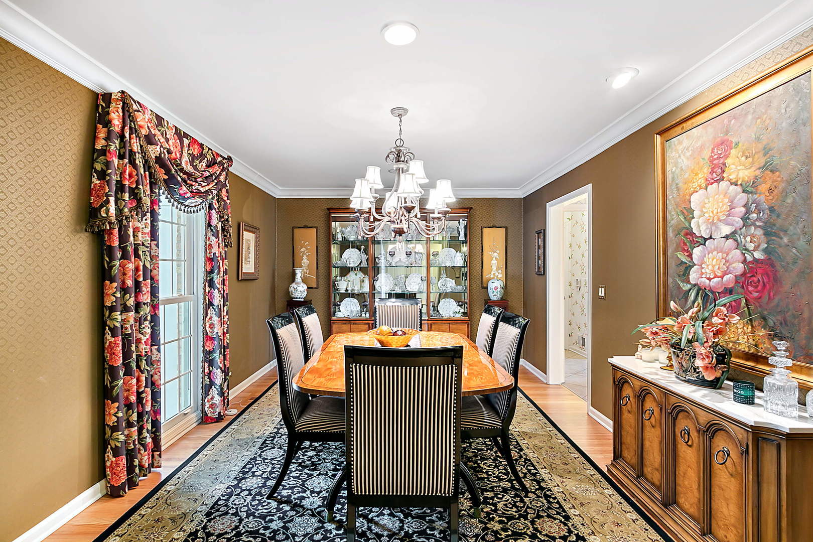 2552 Indian Ridge Court Glenview, IL 60026 - Photo 10 of 45 a dining room with furniture chandelier and wooden floor