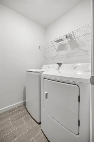 a utility room with dryer and washer