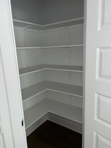 a empty closet with white paint