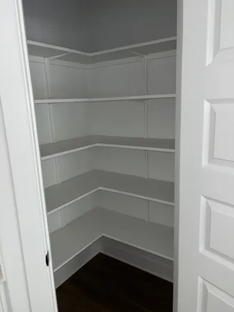 a empty closet with white paint