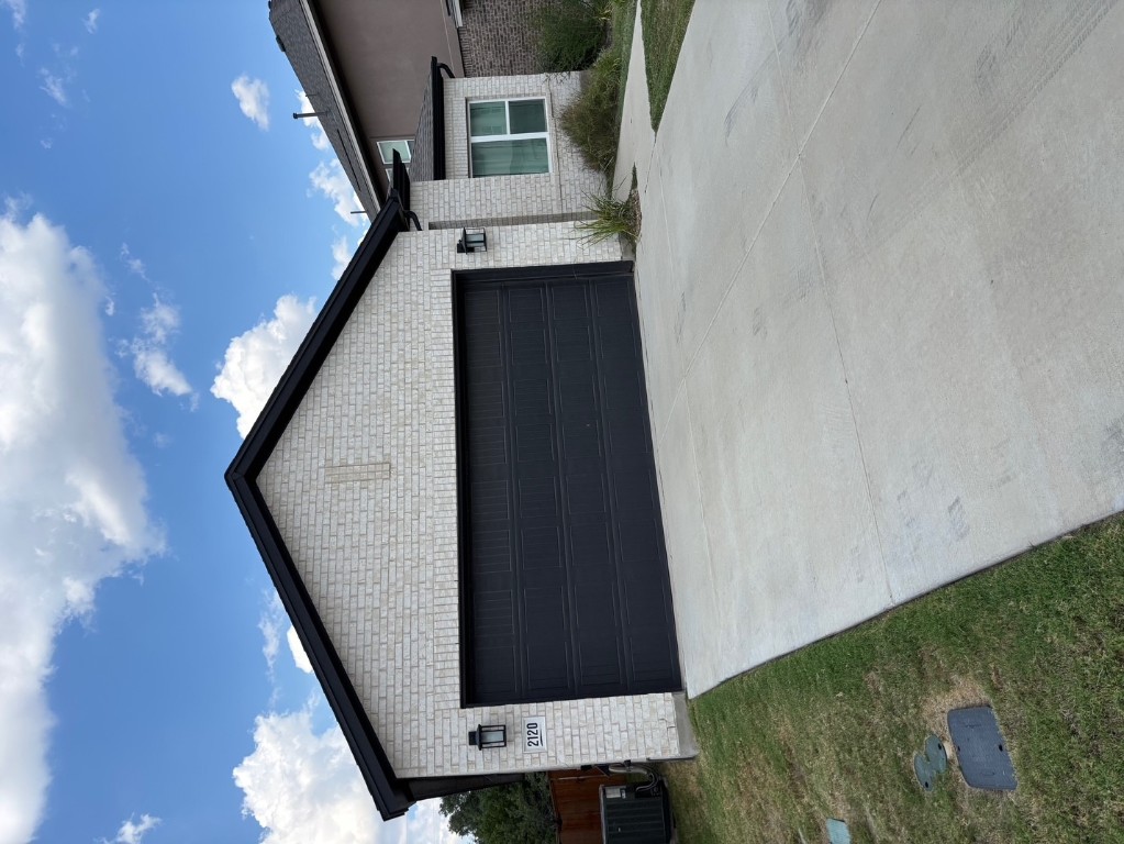 2128 Little Snake Way Georgetown, TX 78633 - Photo 2 of 32 a front view of a house with a yard and garage