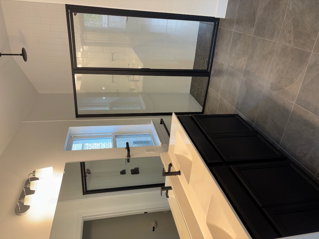 2128 Little Snake Way Georgetown, TX 78633 - Photo 23 of 32 a bathroom with a double vanity sink and mirror