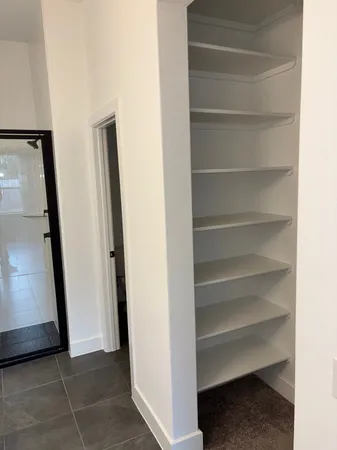 a view of an empty walk in closet
