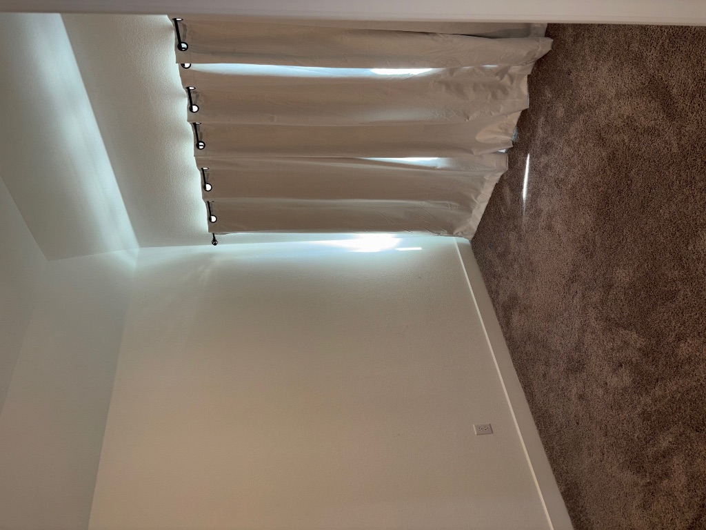 2128 Little Snake Way Georgetown, TX 78633 - Photo 7 of 32 an empty room with windows and a exposed radiator