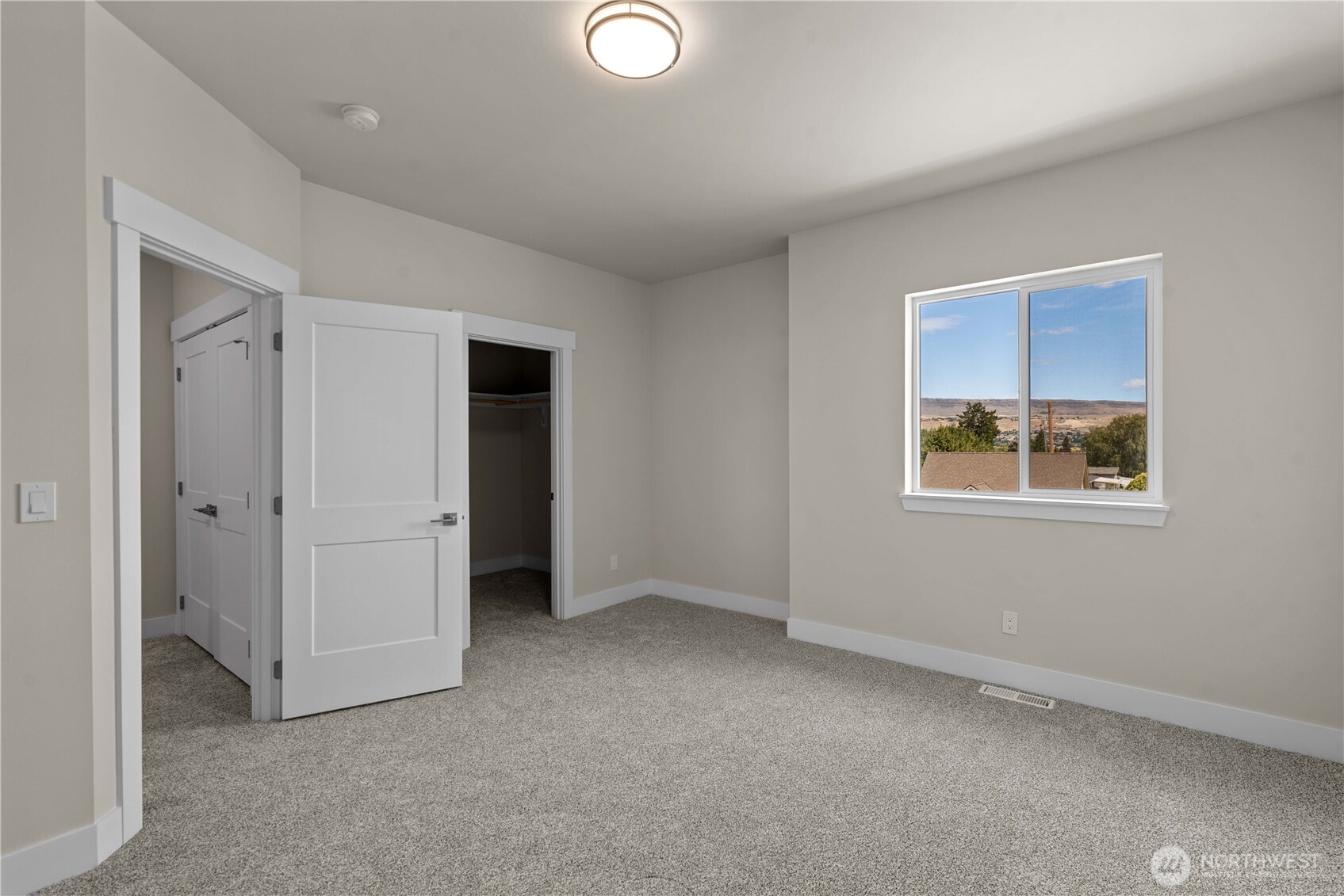 1030 Finch Lane, Unit A3 Wenatchee, WA 98801 - Photo 18 of 24 a view of an empty room with a window