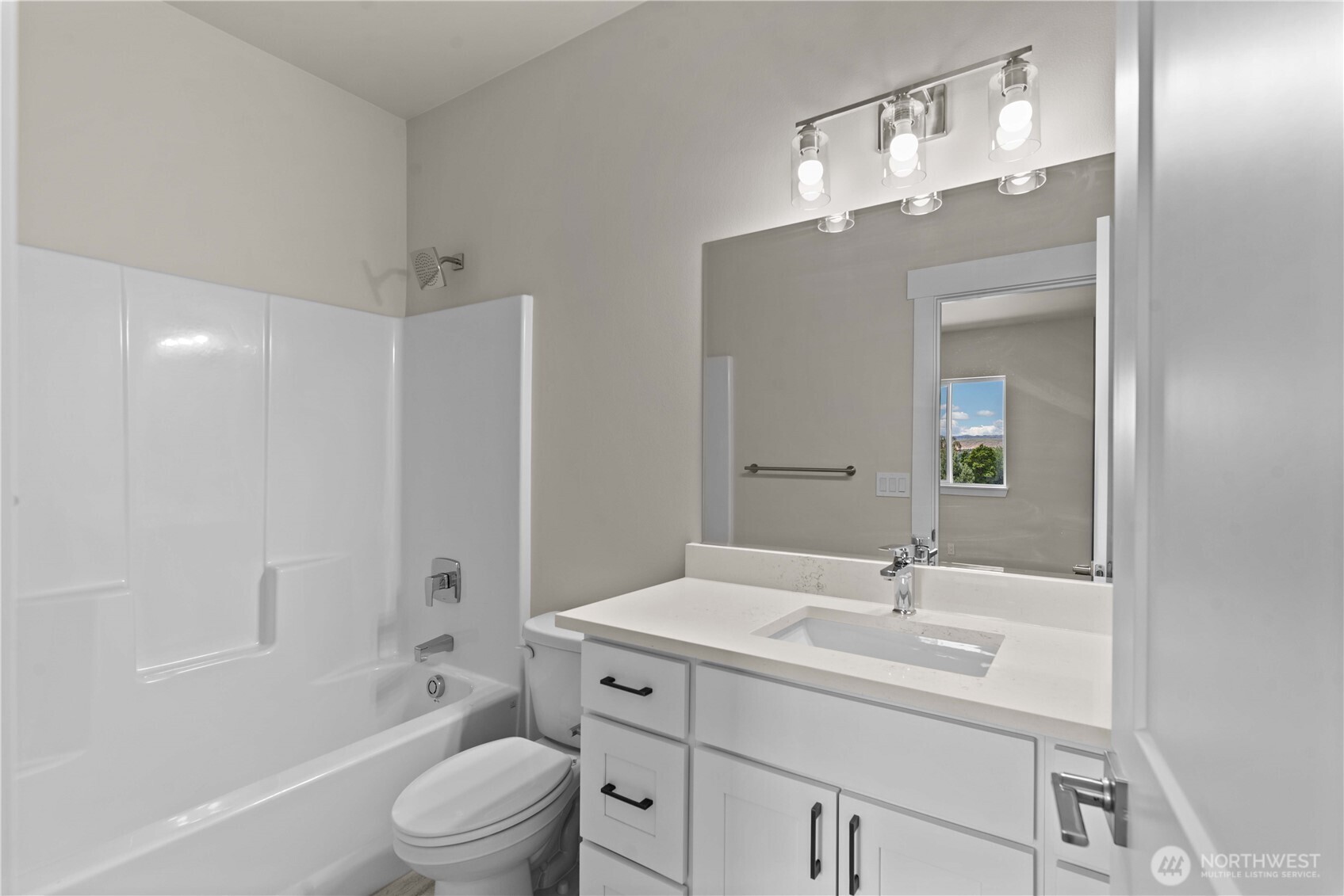 1030 Finch Lane, Unit A3 Wenatchee, WA 98801 - Photo 19 of 24 a bathroom with a sink a toilet and shower