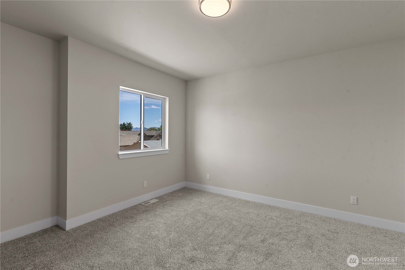 1030 Finch Lane, Unit A3 Wenatchee, WA 98801 - Photo 21 of 24 a view of an empty room with a window