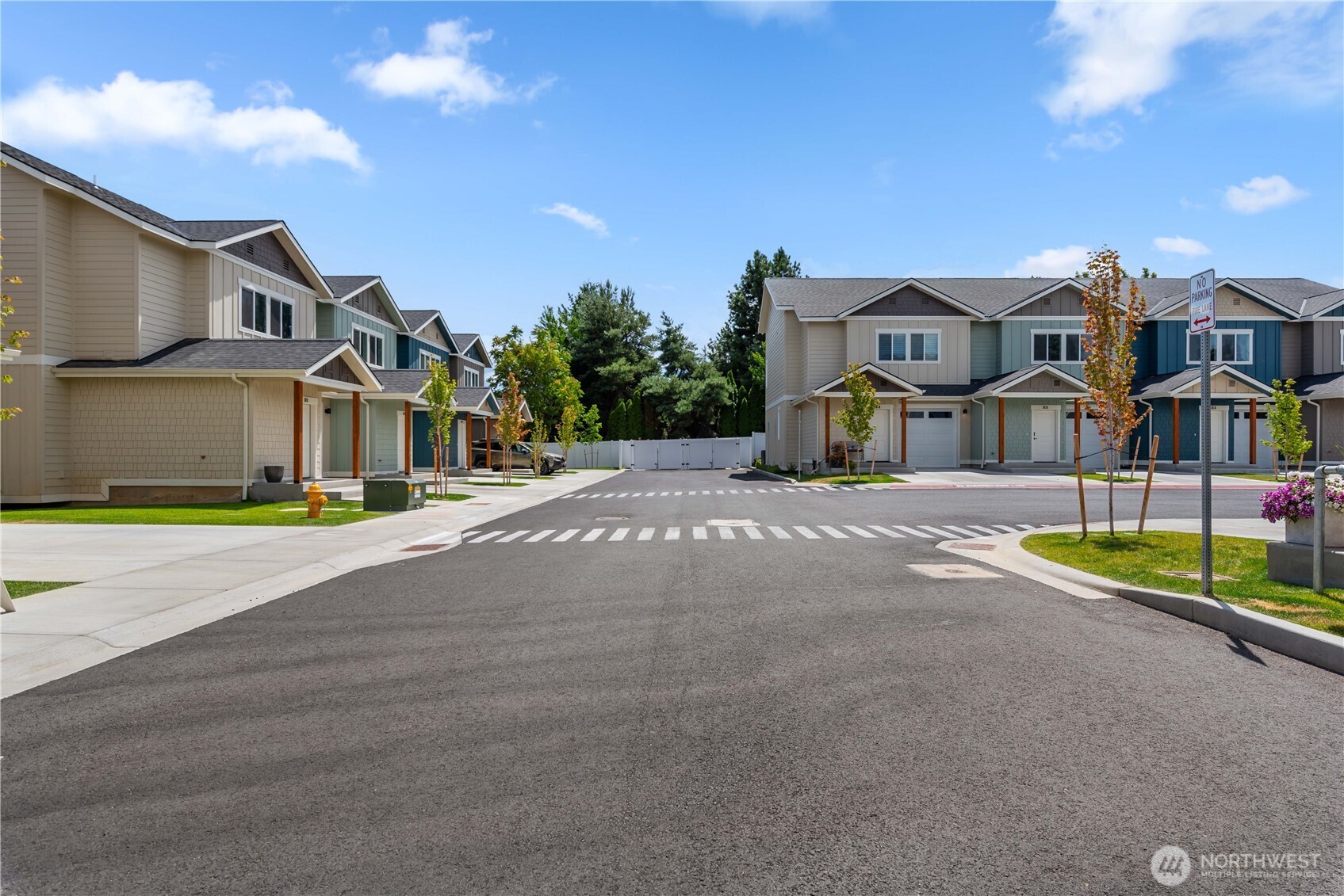 1030 Finch Lane, Unit A3 Wenatchee, WA 98801 - Photo 4 of 24 a front view of a house with a yard