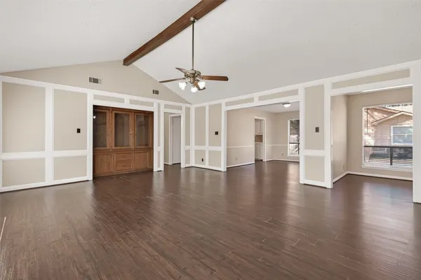 a view of an entryway with wooden floors and door
