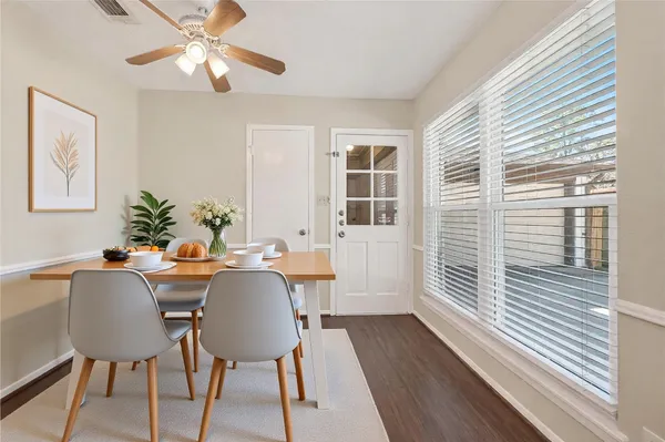 a view of a dining room with furniture window and wooden floor