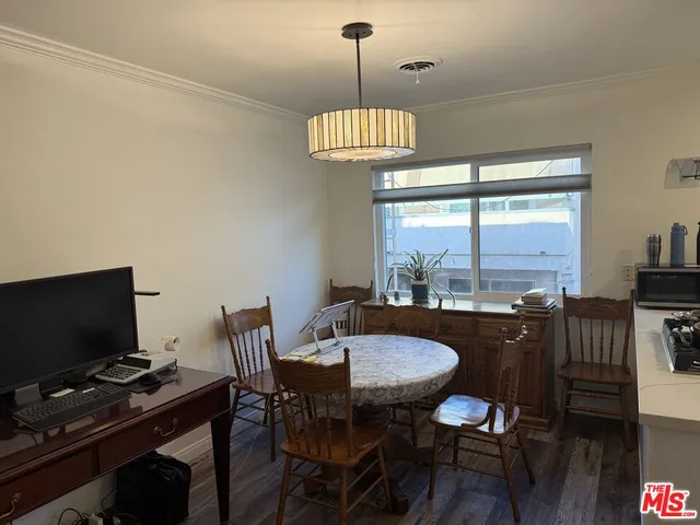 a view of a dining room with furniture window and outside view