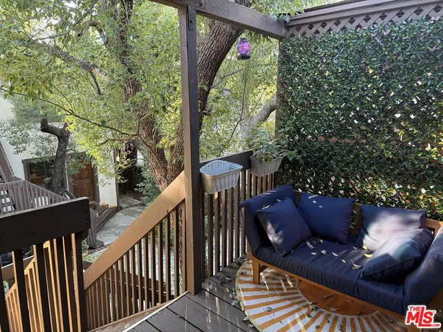 a view of balcony with furniture