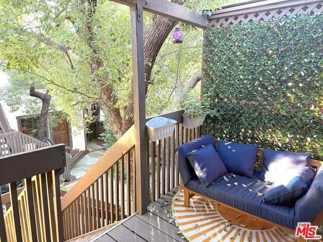 a view of balcony with furniture