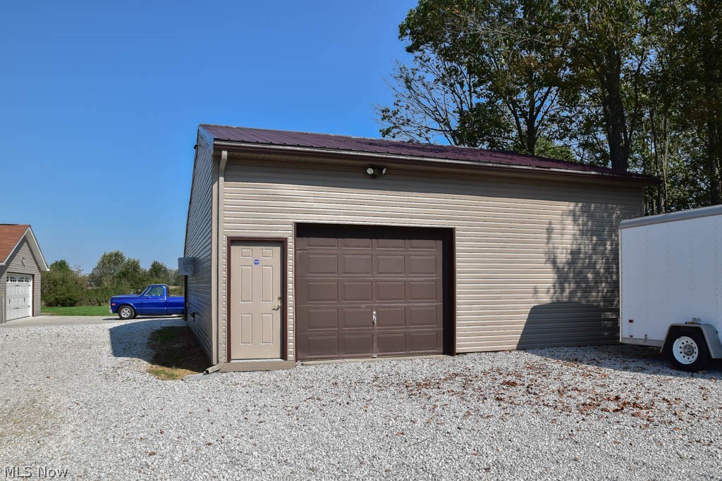 3557 Laubert Road Atwater, OH 44201 - Photo 17 of 21 Heated and cooled outbuilding with a 1-car garage door and 29x29 workshop PLUS a 30x12 garage on the back side.